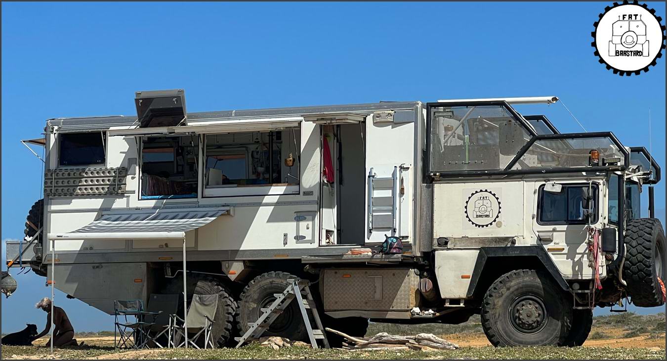 MAN KAT1 6x6 overland truck parked at remote beach campsite